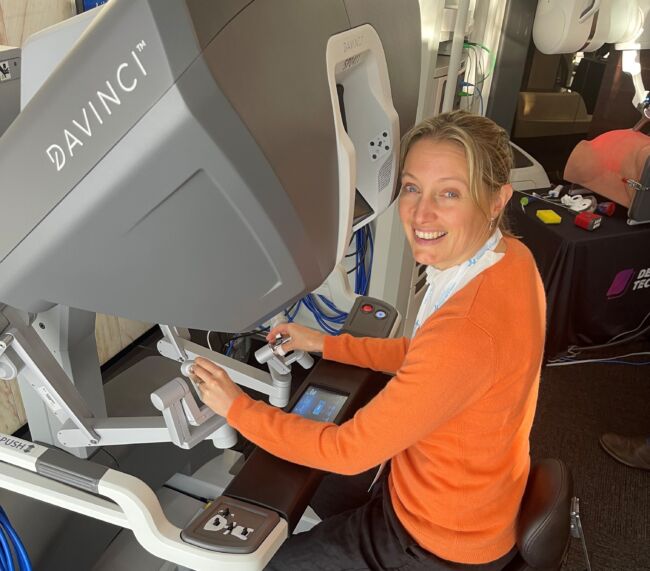 Laura Miller robot orange top smiling – cropped